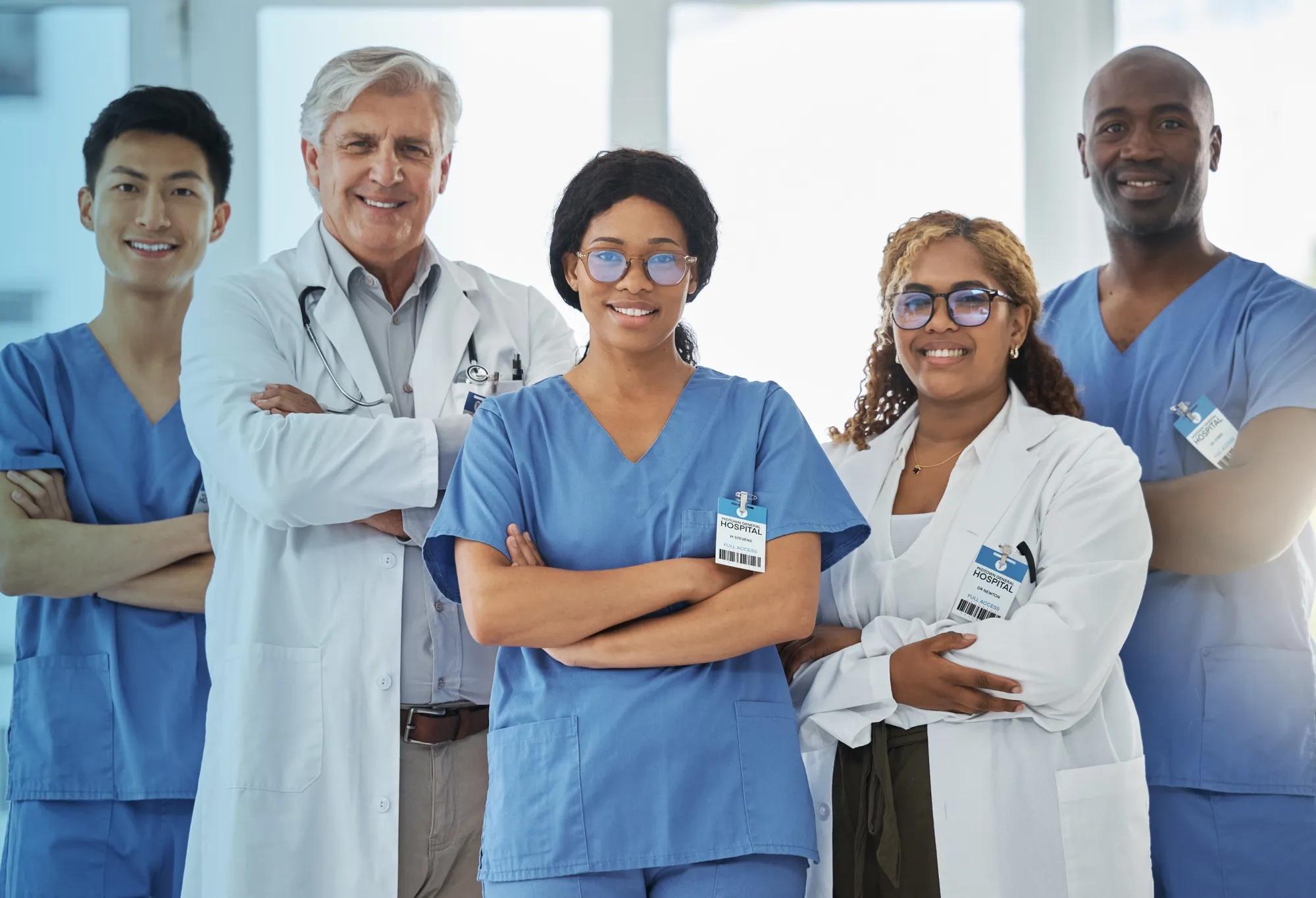 A group of healthcare professionals standing inside a medical facility.