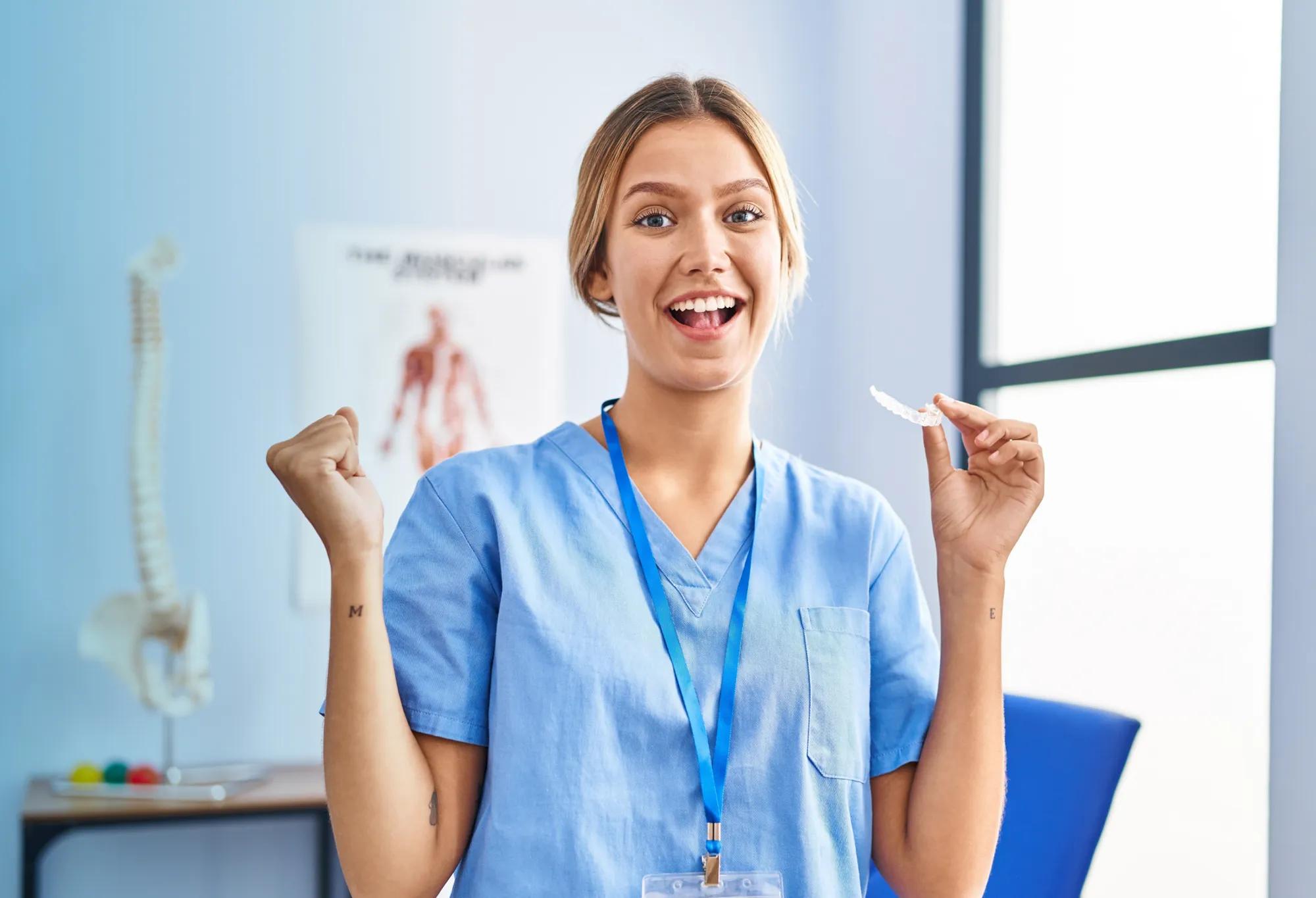 A medical assistant with arms raised in celebration of Medical Assistant Week