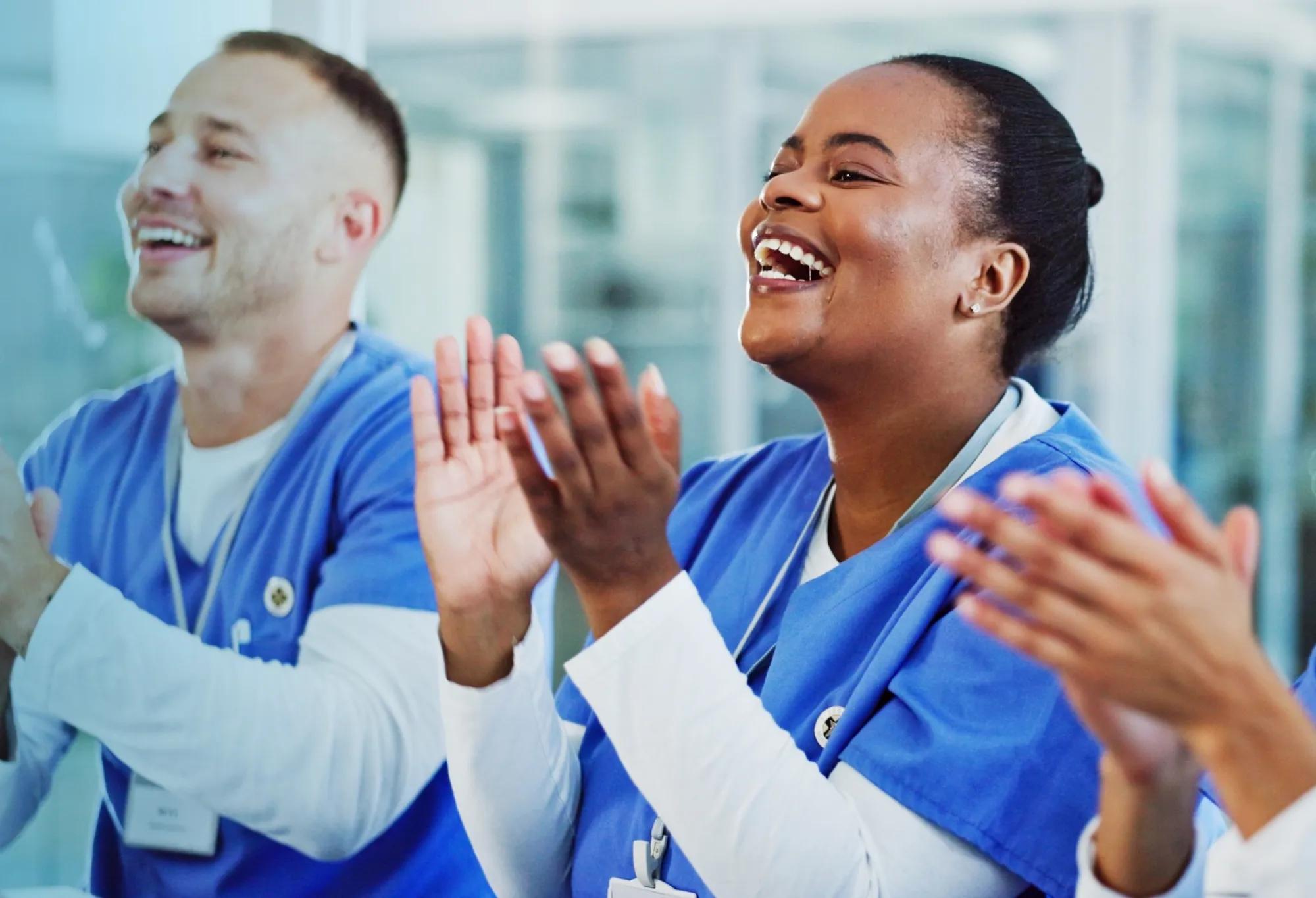 a group of workers celebrating because they achieved their interest in pursuing a healthcare-related career path