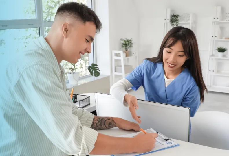 a medical administrative assistant working in a healthcare office after completing medical administrative assistant training