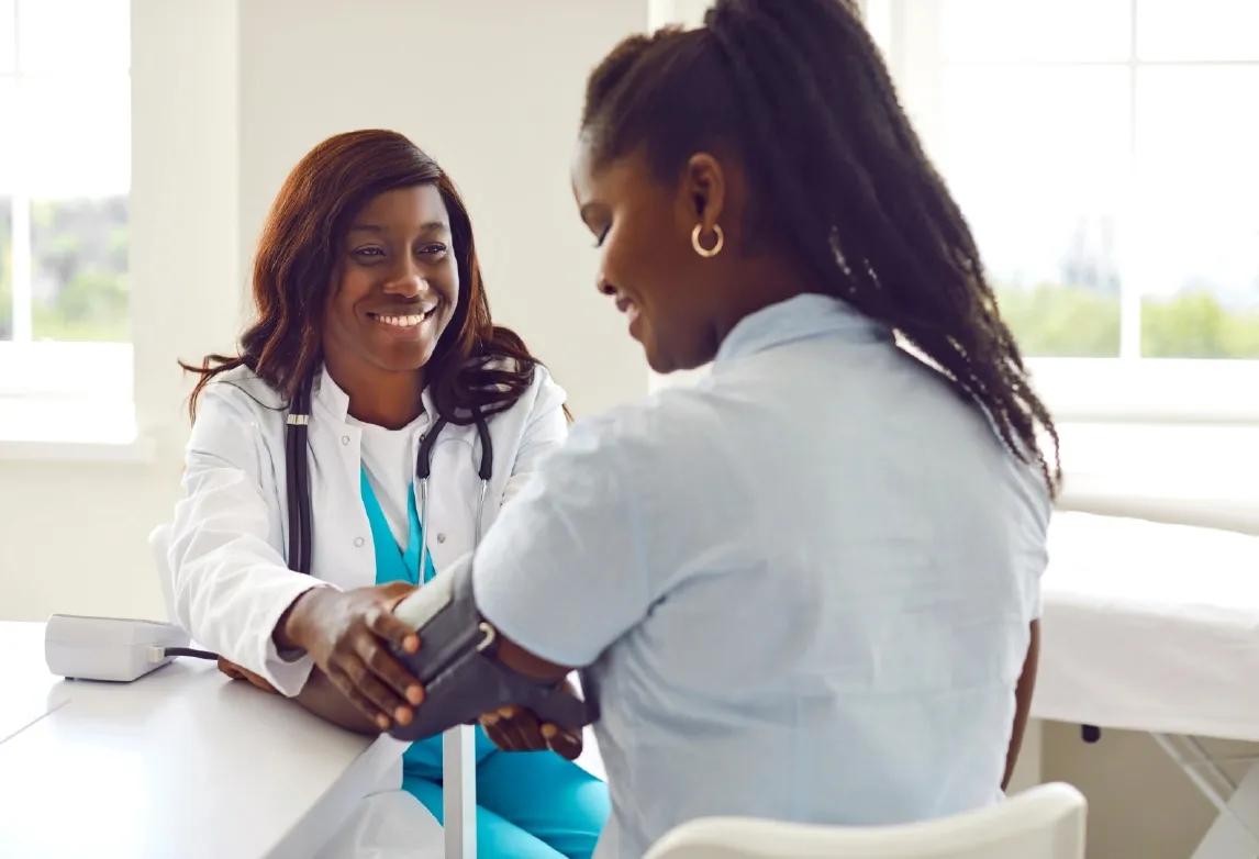 a medical assistant student practicing her skills before taking the exam to become a registered medical assistant or RMA