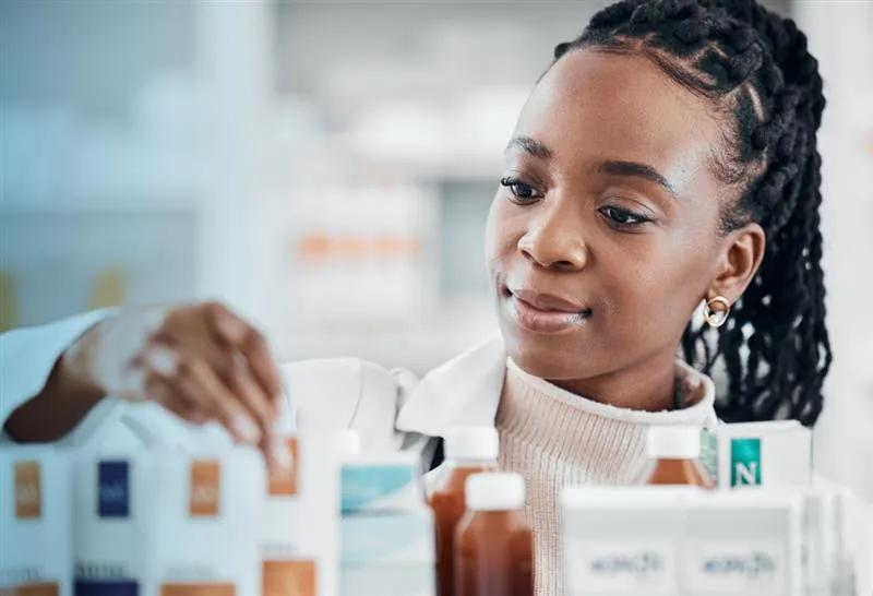 A Pharmacy Technician working in a pharmacy setting.